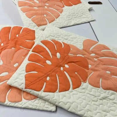 A set of beautiful cushion covers featuring a modern Monstera leaf appliqué design.