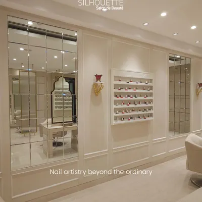 A glimpse into our curated space, where beauty and elegance converge. The wall of mirrors reflects our bright, clean aesthetic, while the neatly displayed polish collection hints at the world of color that awaits you.