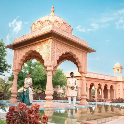 A grand, wide-angle shot that establishes the royal theme. I place the couple within the stunning architecture to create a sense of scale and majesty for their pre-wedding photos.