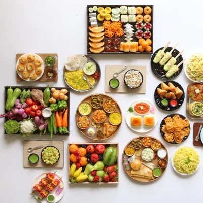 A beautiful display of my recent food miniature orders, showcasing the wide variety of dishes I can create.