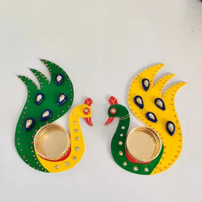 These beautiful peacock T-light holders were made right here in the studio. They are a perfect DIY project for Diwali, adding a personal, handmade touch to your festive decorations.