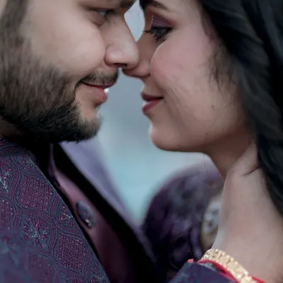 This is the essence of intimacy. A tight close-up where the world fades away and all that matters is the quiet connection between two people. These are the portraits that speak without words, capturing the deep affection in a simple, gentle touch.
