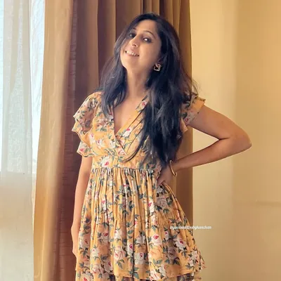 This yellow floral tiered dress is pure sunshine. The poly-cotton fabric is light and airy, and the ruffled layers add a touch of playful grace.
