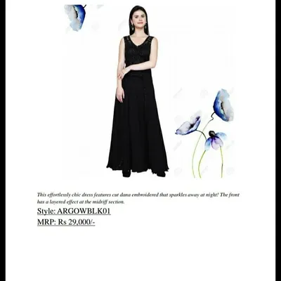 This catalogue image details an effortlessly chic black dress from our AARNA collection. It features cut dana embroidery that sparkles at night and a layered effect at the midriff, with an original MRP of Rs 29,000.