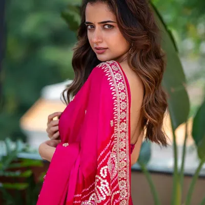 A portrait of actress Ashika Ranganath, captured outdoors with soft natural light. The goal was to create an expressive shot that feels both glamorous and genuine, perfect for a versatile acting portfolio.