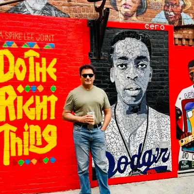 In Brooklyn, New York, standing in front of a mural that says "Do The Right Thing." It's a simple message but a powerful guiding principle for both life and the practice of law.