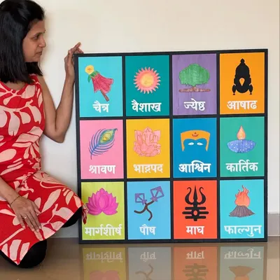 This is one of my favorite creations, a large, hand-painted Marathi month calendar. Each square represents a month with its unique cultural symbol, making it a colorful and meaningful piece of home decor.