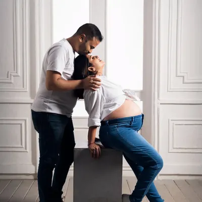 A quiet moment of connection between partners during a maternity shoot. We love capturing these gentle interactions that show the love and support surrounding the mom-to-be.