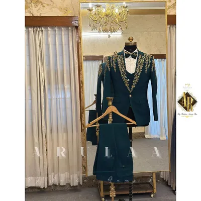 A full look at a custom-designed three-piece wedding suit in a striking teal. The ensemble includes the blazer, waistcoat, and trousers, all tailored from the same premium fabric for a cohesive and modern look.