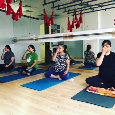 A beautiful moment from a pranayama session where students are practicing Nadi Shodhana, or alternate nostril breathing. This simple breathwork technique is incredibly powerful for balancing the nervous system and calming the mind.