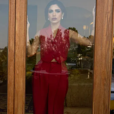 Painting the town red with Bhumi Pednekar in this Rohit Gandhi and Rahul Khanna pantsuit. This look is the definition of power dressing, with its sharp tailoring and bold color making a strong statement.
