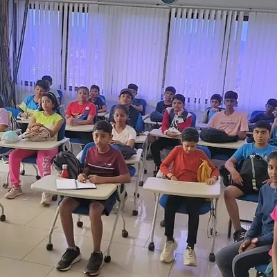 Participants at our Aero Sports Camp in Jakkur listen intently during a classroom session about aviation.