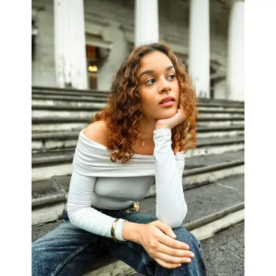 A portrait session near Mumbai's colonial architecture. I used the leading lines of the stairs and the soft, overcast light to frame the subject and create a pensive, cinematic mood.