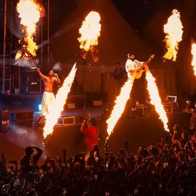 The raw power of a live hip-hop show. Hanumankind commands the stage with fire effects during a packed performance, delivering the high-octane energy I promise.