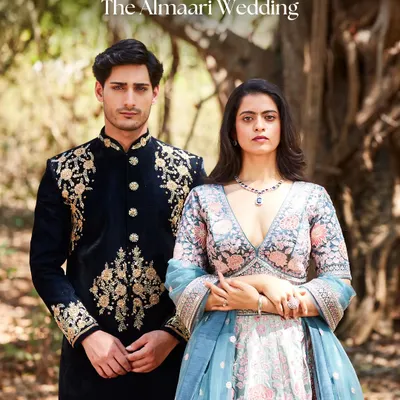This is what I call a power couple. We styled this complete look, from his intricately embroidered sherwani to her floral lehenga and statement necklace, for a high-fashion wedding shoot. This is the level of coordination and style we bring to your big day.