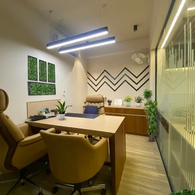 We transformed this office space into a modern green oasis. The addition of framed green wall panels and potted plants enhances the professional environment, boosts well-being, and adds a touch of style.