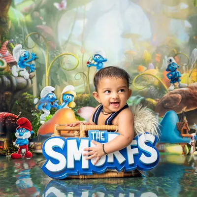 The newest member of the Smurfs village. This happy baby is all smiles in our detailed, custom-designed Smurfs-themed set for his six-month photoshoot.