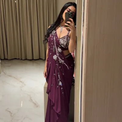 A mirror selfie showing off a gorgeous maroon draped saree. Sometimes the best shots are the ones you take yourself before heading out.