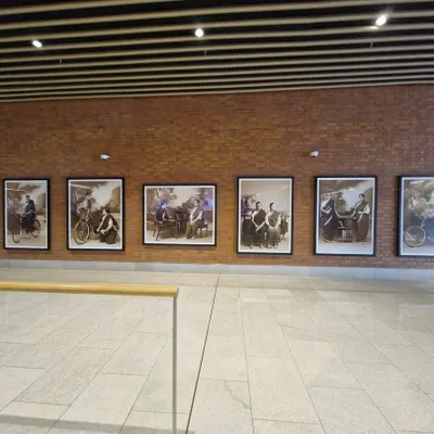 A wide view of the 'Parimala Prasada' photo series by Pushpamala N, acquired by and installed at Terminal 2 of Kempegowda International Airport Bengaluru. I am proud to facilitate such significant public art placements.