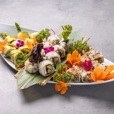 Our Veg Sushi Roll Moriawase Platter is a vibrant medley of our finest vegetarian sushi. It features a variety of rolls, including asparagus tempura, avocado, and cucumber, all beautifully arranged and full of flavor.