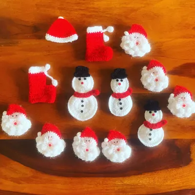 A festive assortment of my Christmas brooches, including Santa faces, snowmen, and mini stockings. These are perfect for holiday parties or as small, thoughtful gifts.