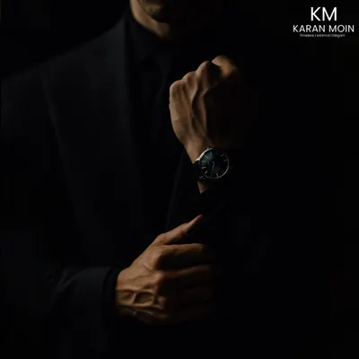 A moody, atmospheric shot capturing the essence of my brand. The focus on the cuff and watch speaks to the details that define a gentleman's style.