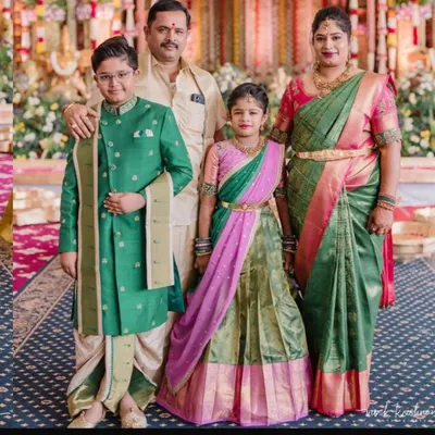 I had the pleasure of designing this complete family look for a special ceremony. We chose a beautiful green and pink theme, creating a custom langa voni for the daughter and a smart sherwani with a dhoti for the son, perfectly complementing the parents' elegant silk attire.