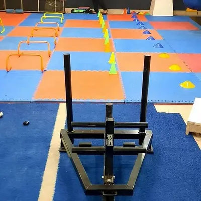 This is where we build real-world power. Our turf track is set up for athletic conditioning with equipment like the power sled, agility hurdles, and cones to improve your speed and explosive strength.