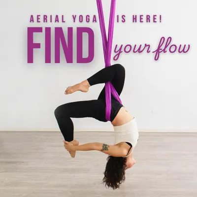 Find your flow and defy gravity in our Aerial Yoga class. Here, a student explores an inverted bow pose, using the silk hammock for support to deepen the backbend and open the heart chakra. This practice is amazing for spinal decompression.