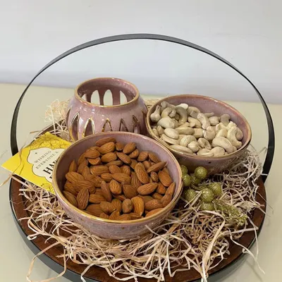 For Diwali, I create these specially curated gift hampers. This one features my 24-carat gold-coated blushing pink bowls and a matching tealight holder, perfect for festive gifting.