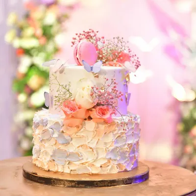 I also arrange for custom cakes to match your theme. This beautiful two-tiered cake with flowers and macarons was perfect for a butterfly party.