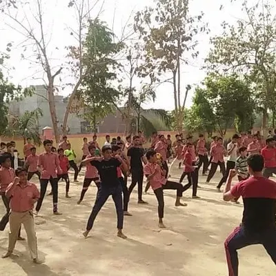 A large group of students during an outdoor self-defense workshop. We often conduct sessions in open spaces to teach skills applicable outside the dojo.