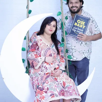 "Oh baby, we have big news!" This couple's announcement photo on our moon swing set is a fun and popular way to share your excitement with family and friends.