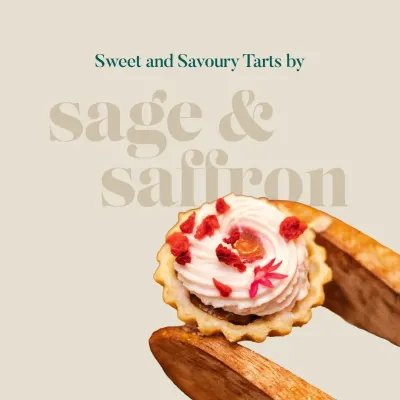 A delicate sweet tart held by wooden tongs, showcasing the perfect swirl of cream and a sprinkle of dried raspberry. This image captures the essence of my sweet and savory tart collection.