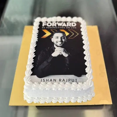 A rectangular photo cake created for a book launch or corporate event, featuring a high-quality edible print of the author.