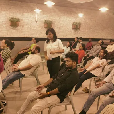 Finding moments of calm during a busy workday is essential for mental health and productivity. Here, I am guiding a corporate group through a chair yoga and meditation session, a simple practice designed to release tension and restore focus right at the office.