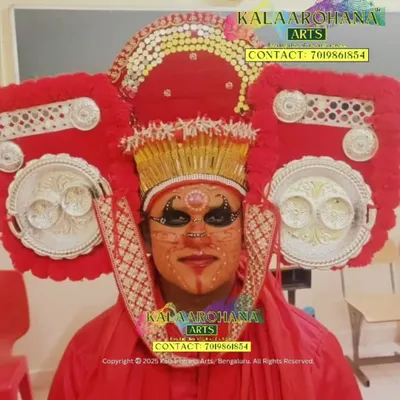 A close-up of the intricate costume and makeup for a Theyyam performance. Theyyam is a vibrant and intense ritualistic art form from Kerala where artists are believed to embody the spirit of the deity.