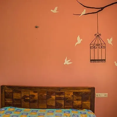For this bedroom wall, the client wanted a calm, nature-inspired theme. I created this stencil painting of birds flying from a cage, which adds a beautiful and meaningful story to the room. This is a great example of custom wall art.