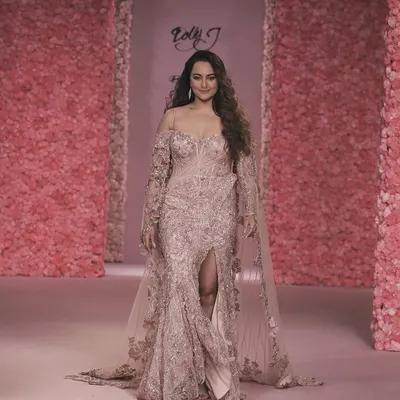 Sonakshi Sinha walks the runway for Dolly J's 'La Vie En Rose' couture show. The backdrop is a testament to our large-scale floral work, with every surface covered in pink blooms to create a completely immersive, romantic atmosphere.