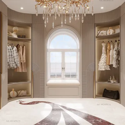 Step into luxury with this stunning dressing room. The design features a beautiful bay window with a seating nook, open closets for easy access, and an exquisite peacock inlay on the floor that flows through the space.
