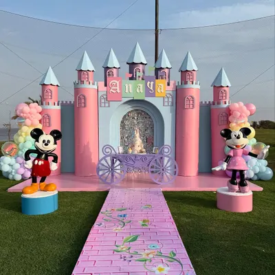 A fairytale castle fit for a princess, complete with Mickey and Minnie to welcome the guests. This large-scale outdoor setup shows our ability to create truly grand and magical entrances.