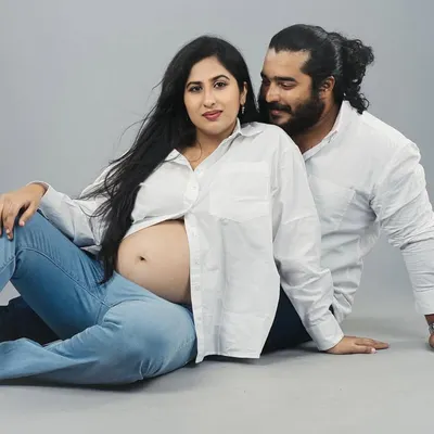 A quiet moment of connection between partners during a studio maternity photoshoot. My goal is to create a relaxed atmosphere where you can feel comfortable, resulting in timeless images that celebrate this special time.