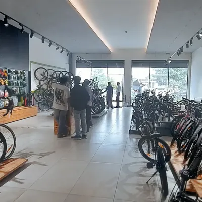 An overall view of a bicycle retail shop I designed. The layout emphasizes open space for easy customer flow, with track lighting to effectively illuminate product displays throughout the store.