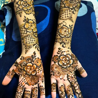 Even little hands can have intricate designs. This beautiful floral pattern was done on a 7-year-old, showing that my detailed work can be adapted for smaller hands.