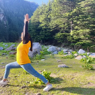 Yoga is a science of well-being, youthfulness, and integrating body, mind, and soul. Here I am practicing a high lunge, feeling the connection with the earth and sky.
