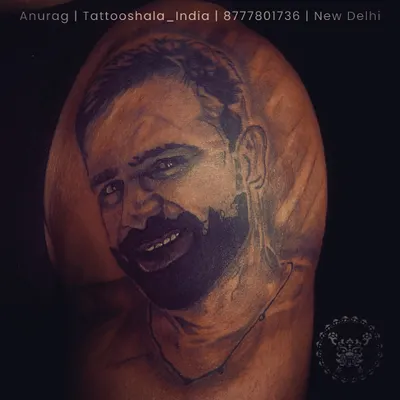 A healed portrait tattoo of a client's loved one. We take pride in creating realistic portraits that stand the test of time. The shading and detail here are crucial for capturing a true likeness.