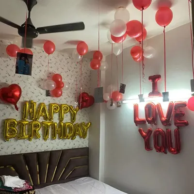 This is one of my most requested birthday packages because it's both celebratory and deeply personal. It features 'Happy Birthday' balloons and the unique, personal touch of your own photos hanging from the ceiling.