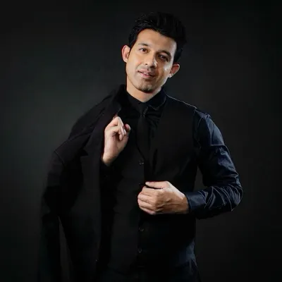 Suited up and ready for a formal event. I can adapt my style for any occasion, from casual pub nights to sophisticated wedding gigs.