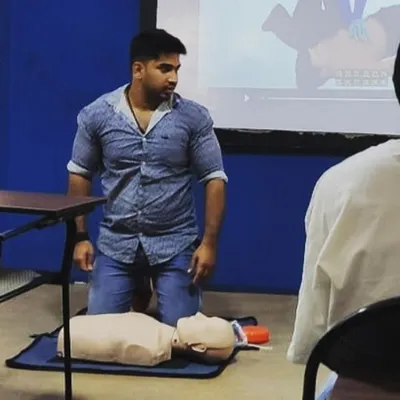 One of our trainers, Akash, practicing CPR techniques during a certification course. We take hands-on training seriously.