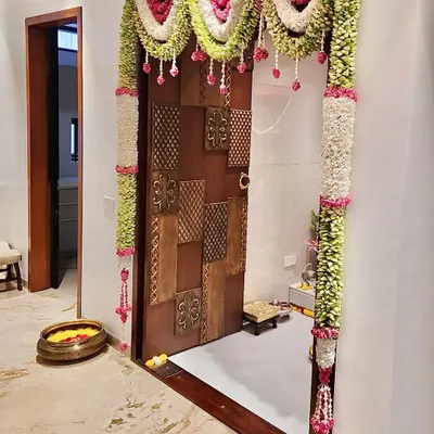 Varamahalakshmi habba shubhashayagalu. For the festival, I created this beautiful door decoration, or 'tomale', using traditional flowers and leaves to welcome the goddess into the home.
